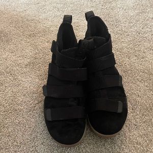 Black Nike LeBron James gym shoes